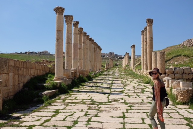 Viv walking through Jerash ruin columns