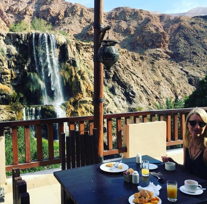 Eating breakfast next to a thermal waterfall in Jordan
