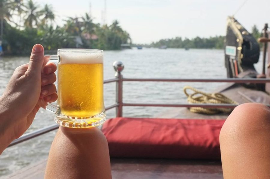 Drinking a Kingfisher beer on the deck of our houseboat in Kerela