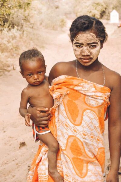 Malgasy woman with face paint and young boy