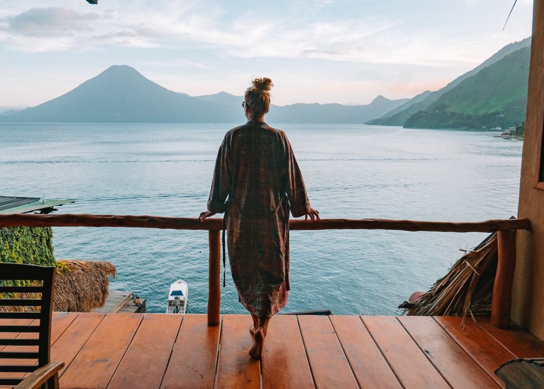 Girl Looking at the volcanoes & sunset on Lake Atitlan, from Laguna Lodge Eco Resort 
