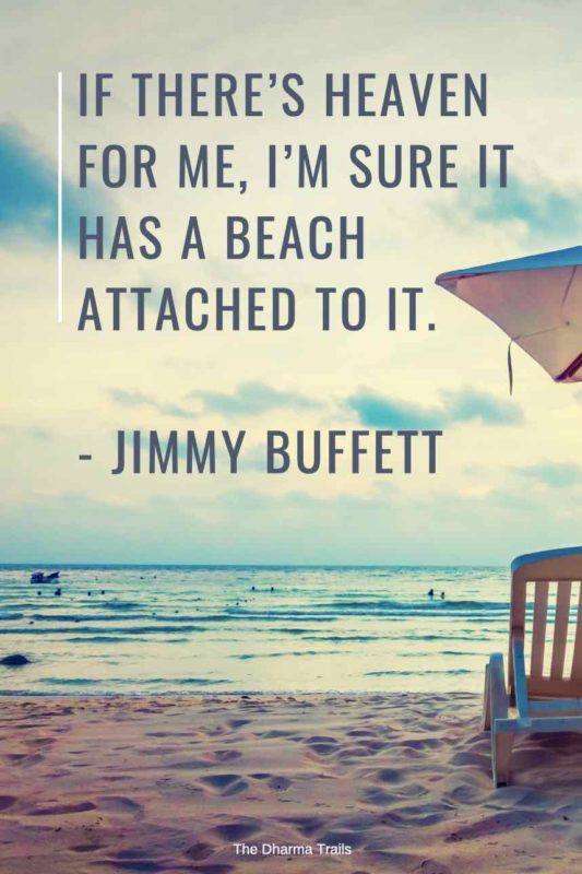 Beach umbrella with text overlay of beach quote by Jimmy Buffet 