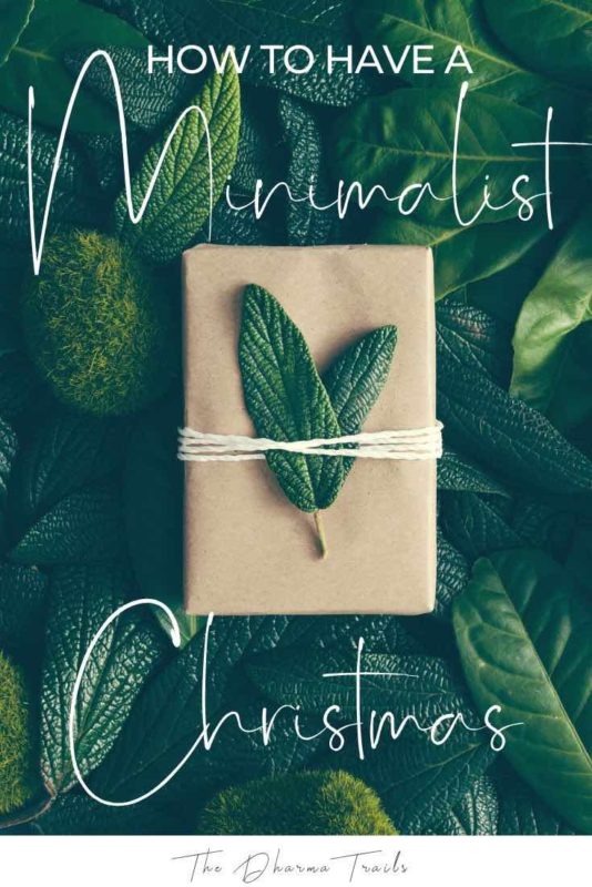green leaves with text overlay how to have a minimalist Christmas
