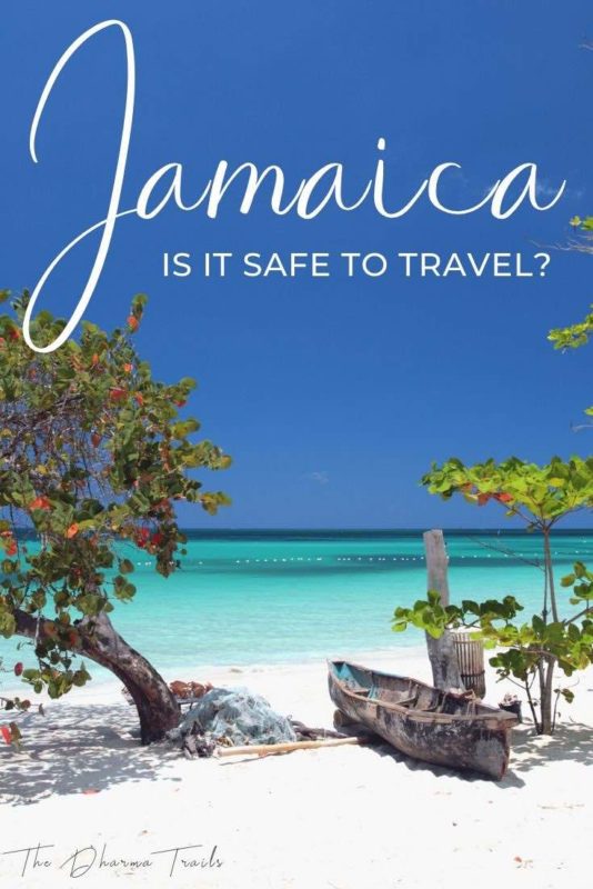 caribbean beach with text overlay jamaica is it safe to travel