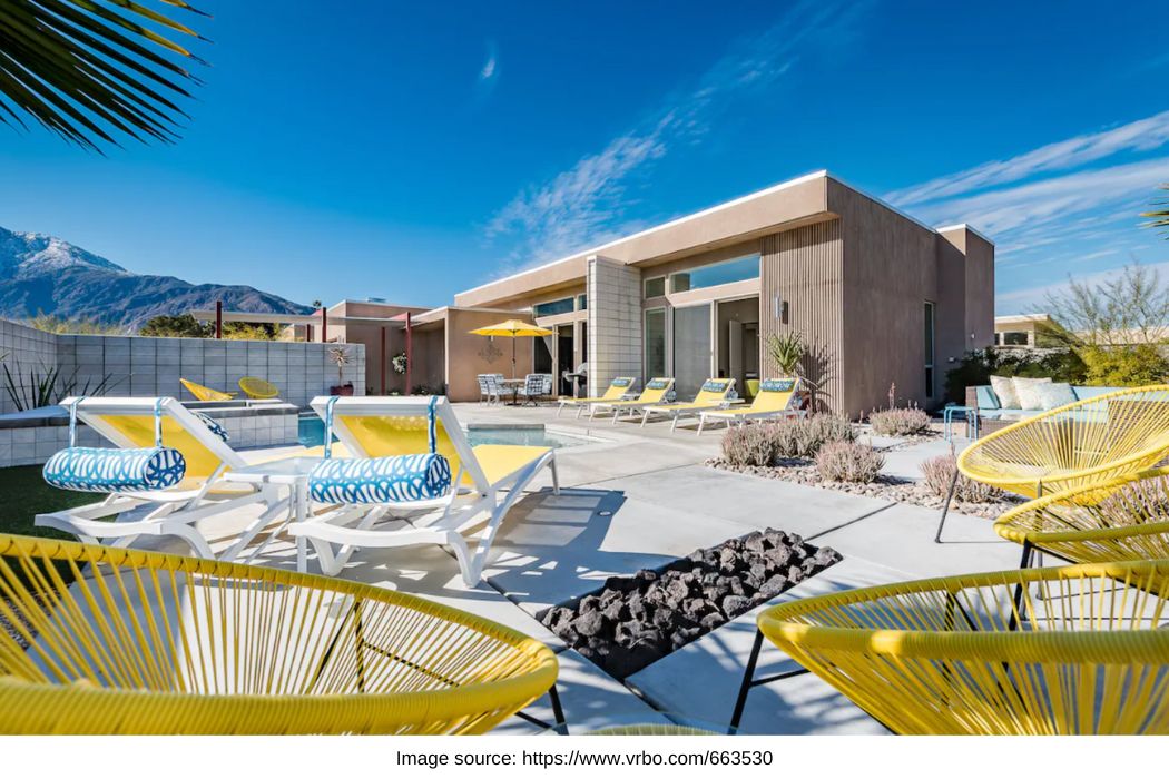 Yellow deck chairs in front of mid century modern rental