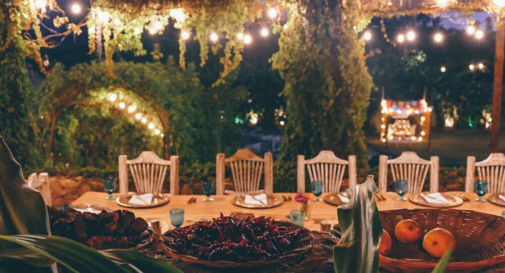 Private mexican dining set up with fairy lights and hanging plants