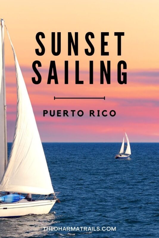colourful sunset with sail boats with text overlay sunset sailing puerto rico