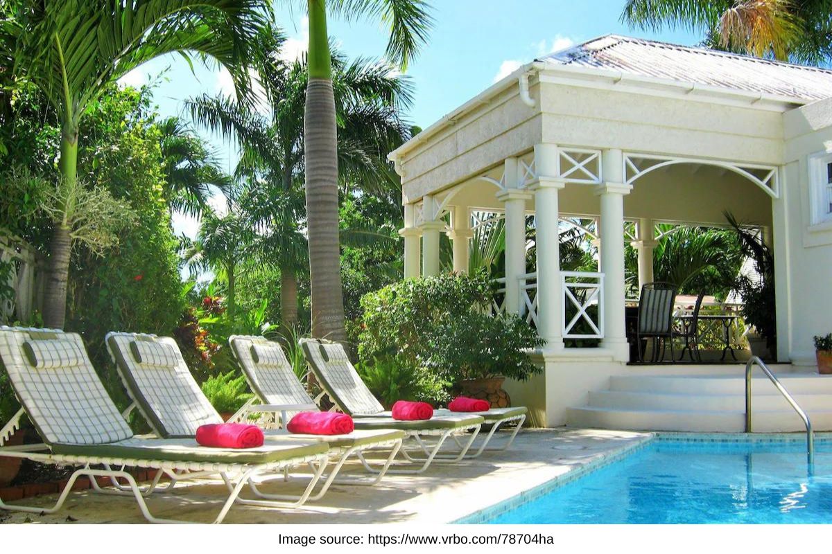 pool with lounge chairs in tropical barbados