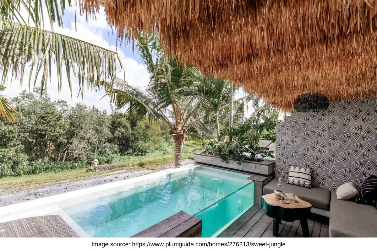 canggu bali villa with thatched roof, private pool overlooking rice paddies