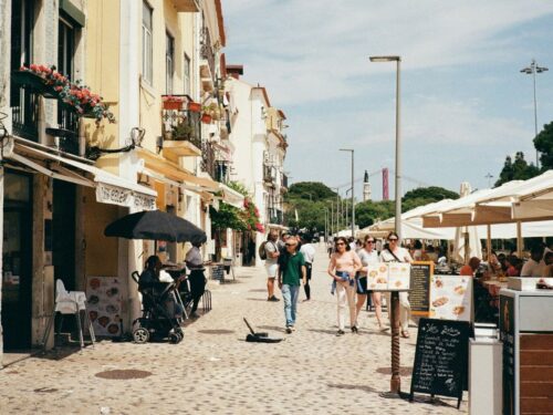 street in Lisbon Portugal with people walking around