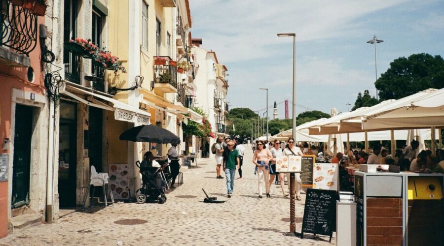 street in Lisbon Portugal with people walking around